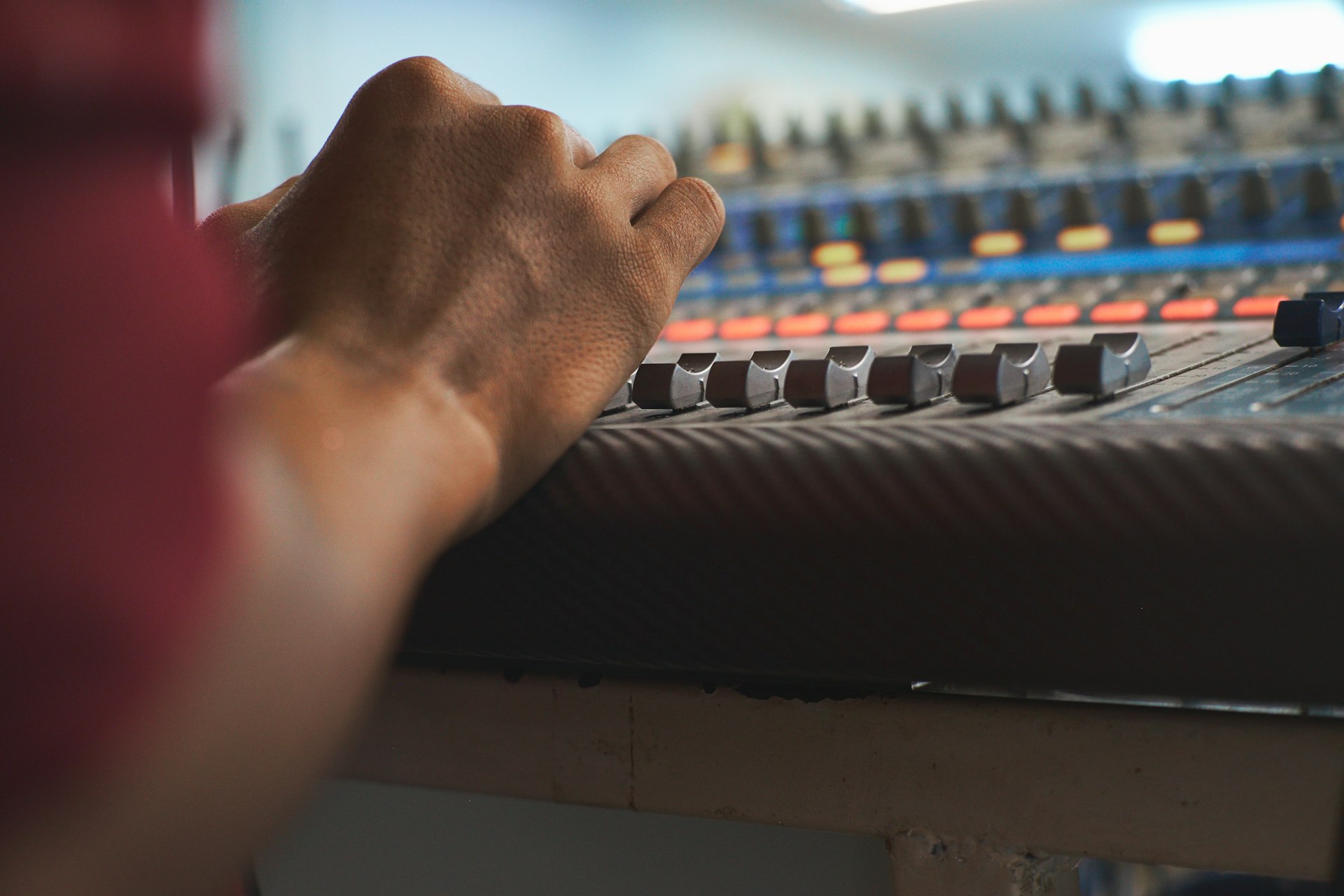 persons hand on black and white piano